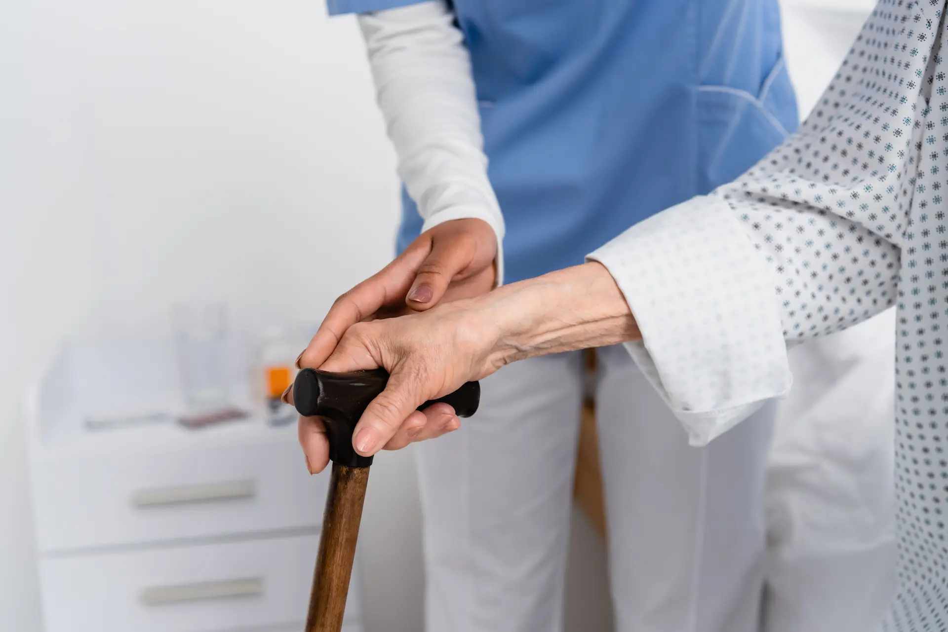 cropped-view-of-african-american-nurse-and-senior-2024-11-09-07-15-17-utc